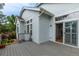 Rear elevation of the home, featuring a spacious deck and beautiful landscaping for outdoor living and enjoyment at 10581 Pearlwood Cir, Highlands Ranch, CO 80126