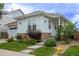 Charming home with stone accents, manicured landscaping, and a welcoming entrance at 10581 Pearlwood Cir, Highlands Ranch, CO 80126