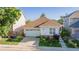 Charming single Gathering home features a well manicured lawn, beautiful flowerbeds and an attached two car garage at 10581 Pearlwood Cir, Highlands Ranch, CO 80126