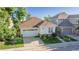Charming single Gathering home features a well manicured lawn, beautiful flowerbeds and an attached two car garage at 10581 Pearlwood Cir, Highlands Ranch, CO 80126