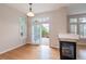 Bright living area boasts hardwood floors, a modern fireplace, and sliding glass doors to a deck at 10581 Pearlwood Cir, Highlands Ranch, CO 80126