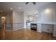 Open-concept living area with hardwood floors, fireplace, and seamlessly connected to the modern kitchen at 10581 Pearlwood Cir, Highlands Ranch, CO 80126