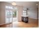 Open-concept living room with hardwood floors, fireplace, and sliding glass doors to the deck at 10581 Pearlwood Cir, Highlands Ranch, CO 80126