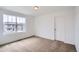 Bright bedroom with a large window that provides natural light and a neutral color palette ready for personalization at 5601 Inland Ave, Firestone, CO 80504