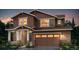 Charming two-story home featuring mixed siding, a welcoming porch, and an attached two-car garage at 5601 Inland Ave, Firestone, CO 80504