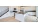 Modern kitchen featuring stainless steel appliances, a center island with a sink, and white cabinets at 5601 Inland Ave, Firestone, CO 80504