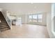 Bright and airy living room with hardwood floors, recessed lighting, and large windows offering scenic views at 5601 Inland Ave, Firestone, CO 80504