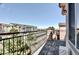 Open balcony showcasing neighborhood view and dark metal railing at 3155 E 104Th Ave # 4E, Thornton, CO 80233