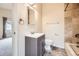 Bathroom features a modern vanity, mirror, updated lighting, and a tiled shower/bath area at 3155 E 104Th Ave # 4E, Thornton, CO 80233