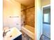 Bathroom with shower-tub combo, stylish tile surround, and vanity at 3155 E 104Th Ave # 4E, Thornton, CO 80233