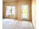 Bright bedroom with large windows and a door, offering views and ample natural light, creating a peaceful ambiance at 3155 E 104Th Ave # 4E, Thornton, CO 80233