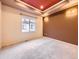 Cozy bedroom with neutral carpet, sconce lighting, and a large window at 3155 E 104Th Ave # 4E, Thornton, CO 80233