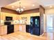 Well-lit kitchen featuring stainless appliances, light wooden cabinets and hardwood flooring at 3155 E 104Th Ave # 4E, Thornton, CO 80233