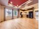 Open-concept living and dining area with hardwood floors and stainless steel appliances in kitchen at 3155 E 104Th Ave # 4E, Thornton, CO 80233
