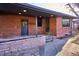 Brick patio with access to backyard and storage room at 725 S Harrison St, Denver, CO 80209