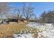 Large backyard with mature trees and partially snow-covered lawn at 725 S Harrison St, Denver, CO 80209