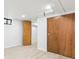 Finished basement room with wood doors and vinyl flooring at 725 S Harrison St, Denver, CO 80209