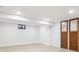 Finished basement room with wood doors and vinyl flooring at 725 S Harrison St, Denver, CO 80209