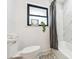 Clean bathroom with marble shower and tiled floor at 725 S Harrison St, Denver, CO 80209