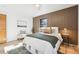 Spacious bedroom with wood floors and a wood accent wall at 725 S Harrison St, Denver, CO 80209