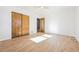 Simple bedroom with wood floors and built-in closet at 725 S Harrison St, Denver, CO 80209