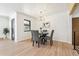 Dining area with hardwood floors and modern chandelier at 725 S Harrison St, Denver, CO 80209