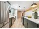 Sleek kitchen with stainless steel appliances and white farmhouse sink at 725 S Harrison St, Denver, CO 80209