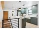 Modern kitchen with dark green cabinets and white countertops at 725 S Harrison St, Denver, CO 80209