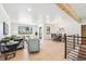 Open concept living and dining area with hardwood floors and a modern aesthetic at 725 S Harrison St, Denver, CO 80209