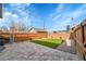 Backyard area with artificial turf, patio, and fenced perimeter at 1578 N Meade N St, Denver, CO 80204