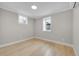 Bright bedroom with wood floors and two windows offering ample natural light at 1578 N Meade N St, Denver, CO 80204