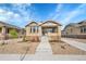 Inviting brick home exterior with landscaped front yard and walkway at 1578 N Meade N St, Denver, CO 80204