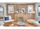 Living room brick fireplace, hardwood floors, and modern decor at 1578 N Meade N St, Denver, CO 80204