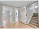 Entryway with hardwood floors, white trim, and staircase to upper level at 1578 N Meade N St, Denver, CO 80204