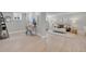 Open floor plan featuring a living room with modern decor and an adjacent home office at 1578 N Meade N St, Denver, CO 80204