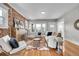 Cozy living room with hardwood floors, exposed brick, and ample natural light at 1578 N Meade N St, Denver, CO 80204