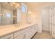 Modern bathroom with double vanity, sleek white cabinets, and large mirrors at 641 Skyhook St, Erie, CO 80516