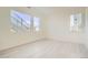 Well-lit bedroom with hardwood floors and large windows providing plenty of natural light at 641 Skyhook St, Erie, CO 80516