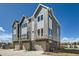 Stylish exterior showcases modern townhomes with private garages and contemporary design elements at 641 Skyhook St, Erie, CO 80516