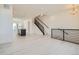 Open-concept living space with modern finishes, hardwood floors, and ample natural light, and kitchen in view at 641 Skyhook St, Erie, CO 80516