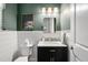 Elegant half bathroom featuring stylish fixtures, a marble countertop, and modern decor at 2027 Vallejo Loop, Broomfield, CO 80023