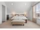 Bright Primary bedroom with vaulted ceiling, a large window, and carpet flooring at 2027 Vallejo Loop, Broomfield, CO 80023