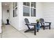 Cozy front porch with seating, perfect for relaxing and enjoying the outdoor ambiance of this home at 2027 Vallejo Loop, Broomfield, CO 80023