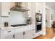 Well-equipped kitchen with stainless steel hood, modern appliances, and ample counter space at 2027 Vallejo Loop, Broomfield, CO 80023