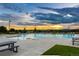 Resort style swimming pool featuring a zero entry area, lounge chairs, and picnic tables at 2027 Vallejo Loop, Broomfield, CO 80023
