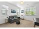 Cozy room with windows and a sofa for relaxing at 2027 Vallejo Loop, Broomfield, CO 80023