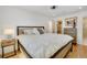 Bedroom with hardwood floors, closet, and a comfortable king-size bed at 32 Skyline Dr, Wheat Ridge, CO 80215