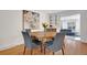 Inviting dining area with hardwood floors, a wood table, and views to the living room at 32 Skyline Dr, Wheat Ridge, CO 80215