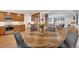 Beautiful dining area with a wood table, open to the kitchen and living areas, hardwood floors at 32 Skyline Dr, Wheat Ridge, CO 80215