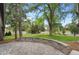 Beautiful view of a landscaped front yard with mature trees at 32 Skyline Dr, Wheat Ridge, CO 80215
